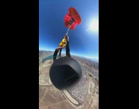 girl on parachute spins in sky