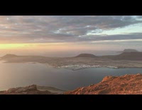 Sunset sunrise ocean water brown mountain view 