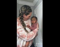 Pink sweater girl hits door tricks baby 