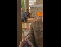 Woman cheetah print jacket take selfie pub