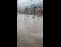 Flood overflow from manhole on street