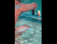 Man splash pool water on brown can