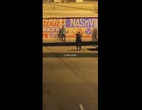 LMAO basic girl poses in front of Nashville sign