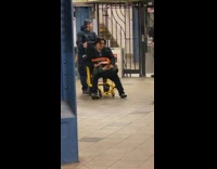 Drunk guy gets taken out of subway station by police on wheelchair gurney 
