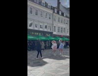 Women in skirt dance cover at the street