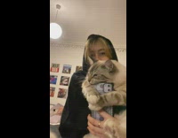 Cat tries to eat phone when woman takes selfie video