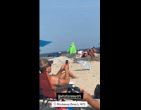 Collab WINY - Person wear green monster inflatable rockaway beach