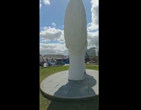 Two large head statue face to face at the park