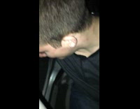 guy black shirt throwing up from car