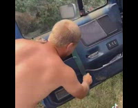Guy opens car window with strap 