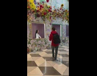 Woman traditional dress sing in frame flowers