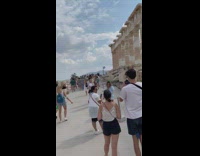 Woman blue opened top outfit poses on the Athens ruins Part 1