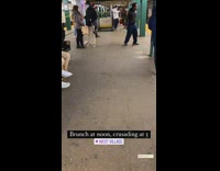 Guy holding onto black axe at subway stop