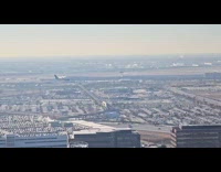 Man on plane parallel landing with another