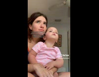 ClipsIG - Lady and Baby Squints as they Check Passerby