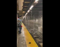 Water leaking from all directions onto subway tracks