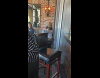 girl shaking shoulders restaurant video