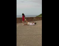 Girl red dress hold photographer shoe pose