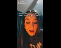 Black shirt girl in room lip syncs 