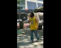 Guy wearing lakers jersey plays ping pong 