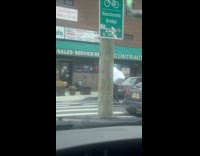 Man with plastic bags on neck while riding scooter 