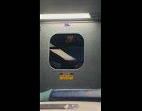 Picture of woman on subway train window