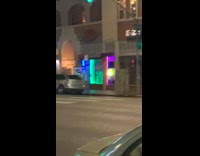 Group of people poses in the middle of the street