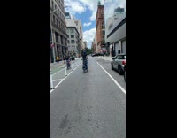 Man does bike tricks falls on street