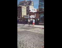 Guy shirtless denim jacket hold head street