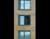Guy cleans window from high floor 