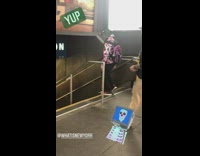 Man Walks with TV Monitor on Head 