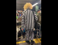 Collab WINY - Person wear Beetlejuice costume at subway station