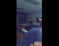 Guy bats a bottle off asleep friends head