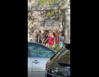 People dances behind the fence video shoot