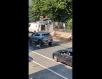 Collab WINY - Man taking shower in front of firehydrant 