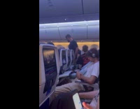 Man inside the plane with no shirt on