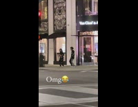 Man and woman tiktok dance sidewalk nighttime