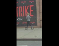 Grey jacket lady jogs bounce shoes sidewalk