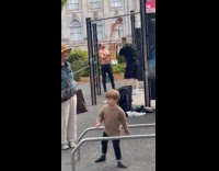 Woman in dress left at playground bars