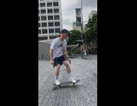 Skater jumps over street barrier 