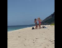 Two women tiktok dance cheered by strangers beach