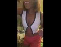 Woman takes bite of hot food from air fryer 