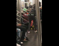"Normal day" video in a subway train, lady has a cat on her back, dance is performing with his blue snapback
