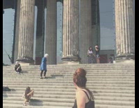 Girl black dress sit pose stairs tourists