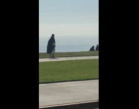 Woman and Jesus dance grass tripod ocean