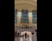 Man elf costume stands at subway terminal