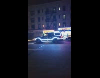 Black car covered in reflective tape strips 