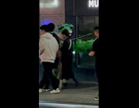 Collab winy - Frog mascot on street with frog balloons