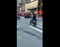 Man on bike singing true on mic and speakers