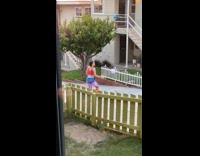 Woman red tank top tiger claw pose photo shoot yard